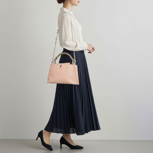Capucines MM Magnolia Taurillon Leather and Python Bag - Louis Vuitton - Modalova