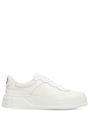 Gg Embossed Leather Sneakers - GUCCI - Modalova