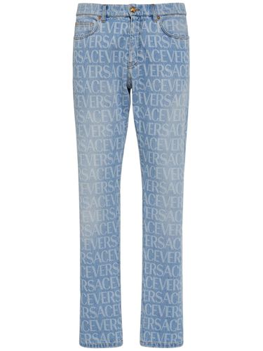 Monogram Cotton Denim Jeans - VERSACE - Modalova