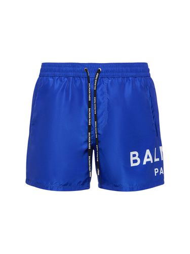 Logo Printed Stretch Nylon Swim Shorts - BALMAIN - Modalova