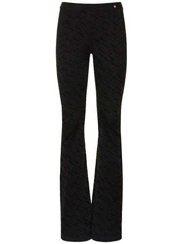 Logo Jacquard Knit Viscose Flared Pants - VERSACE - Modalova