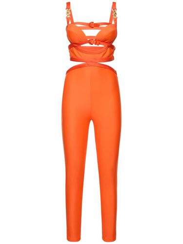 Dua Lipa Cutout Tech Jersey Jumpsuit - VERSACE - Modalova