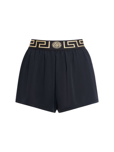 Shorts In Lycra Con Greca - VERSACE - Modalova