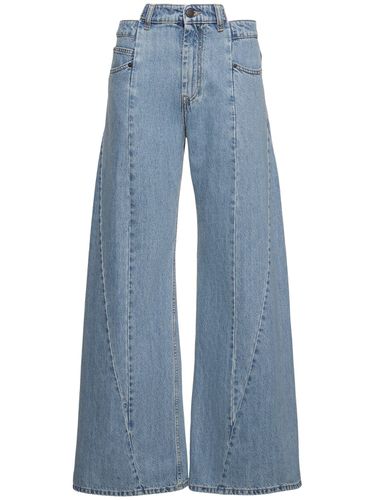 Jeans Larghi Asimmetrici In Di Cotone - MAISON MARGIELA - Modalova