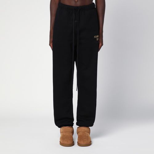 Black jogging trousers with logo - Fear of God Essentials - Modalova