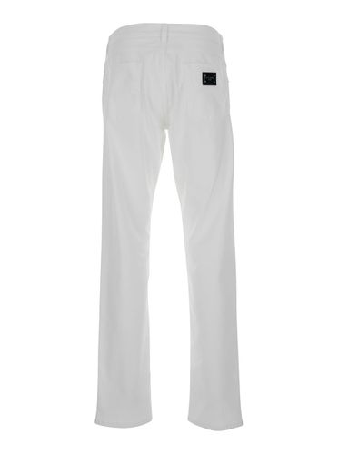 Slim Jeans With Logo Plaque In Stretch Cotton Denim Man - Dolce & Gabbana - Modalova