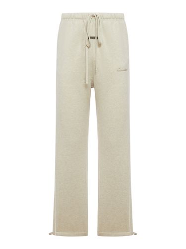 RELAXED FLEECE TRACKPANTS WITH PIPING - Man - Fear Of God Essentials - Modalova