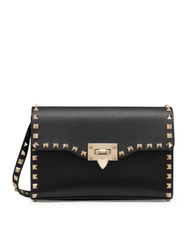 SMALL ROCKSTUD CROSSBODY BAG IN GARNET CALFSKIN - Woman - Valentino Garavani - Modalova