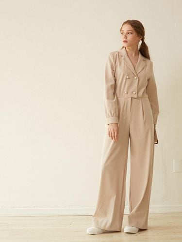 Double Button Jumpsuit Beige - HOLLYSATUNS - Modalova