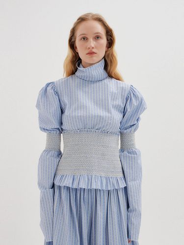 TWINK Smocked Turtleneck Blouse () - EENK - Modalova