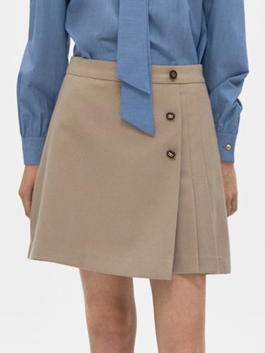 Pleated Mini Wrap Skirt - Beige - DEPOUND - Modalova