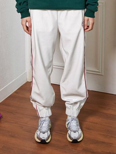 VELVET TRACK JOGER PANTS_WHITE - MENASOO - Modalova