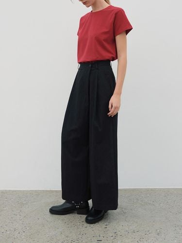 Unbalanced chin-detail pants BLACK - The Raust - Modalova