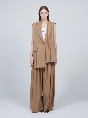 Signature asymmetrical pleated flare slacks - MMAM - Modalova