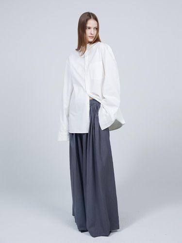 Signature asymmetrical pleated flare slacks - MMAM - Modalova