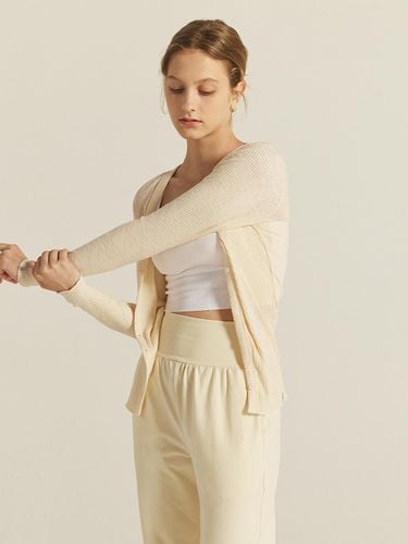 Cosy Ribbed V-neck Cardigan_Light beige - REINAMORA - Modalova