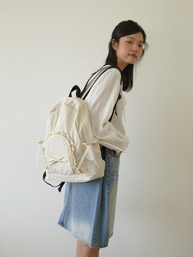 Ruffle ribbon backpack_beige - ovuni - Modalova