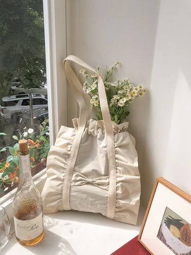 Ruffle draw string bag_beige - ovuni - Modalova