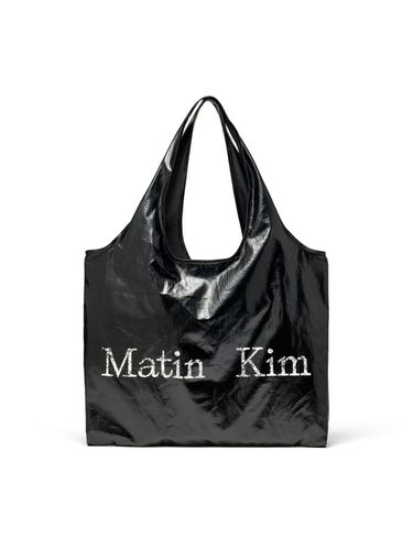 MATIN CRACKED LOGO GLOSSY ECOBAG IN STRONG - Matin Kim - Modalova