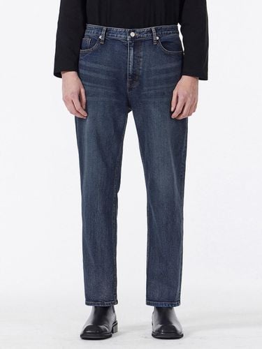 Signature Studded Tapered Crop-Fit Denim Pants [Dark Indigo] - VARZAR - Modalova