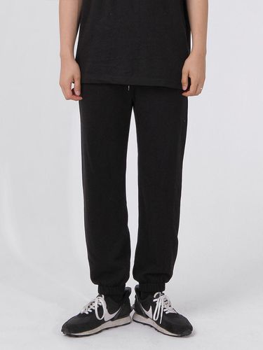 Cotton Regular Fit Tapered Jogger Pants [Black] - THESTORI - Modalova