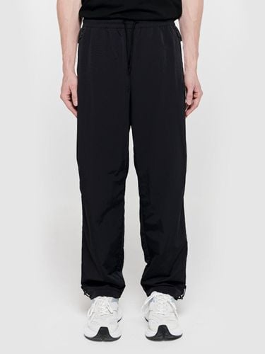 Champion Woven Track Relaxed Fit Pants [Black] (U2LPT3303BK) - UFCSPORT - Modalova