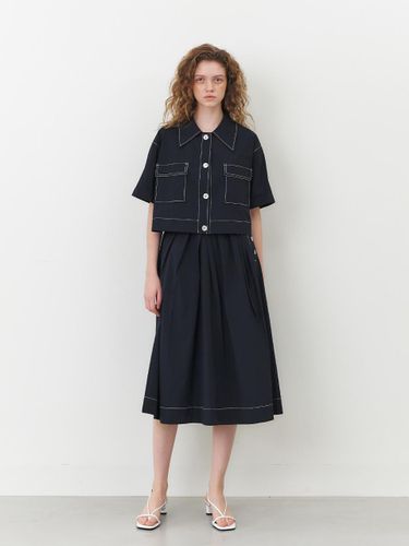 Stitch Button Asymmetrical Pleated Skirt - MOHAN - Modalova