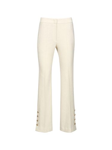 SIDE BUTTON DETAILED TROUSERS (CREAM) - YCH - Modalova