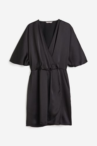 Wickelkleid aus Satin Schwarz, Alltagskleider in Größe L. Farbe: - H&M - Modalova