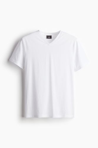 T-Shirt mit V-Ausschnitt Muscle Fit Weiß in Größe L. Farbe: - H&M - Modalova