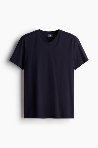 T-Shirt mit V-Ausschnitt Muscle Fit Marineblau in Größe XS. Farbe: - H&M - Modalova