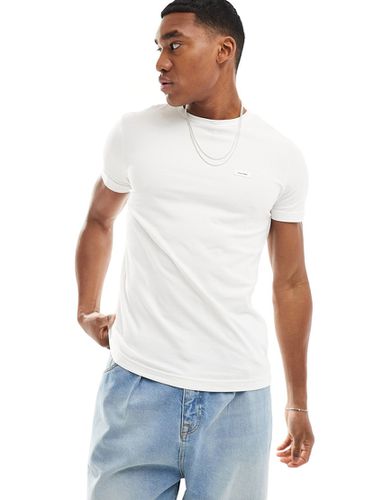 T-shirt slim fit elasticizzata bianca - Calvin Klein - Modalova