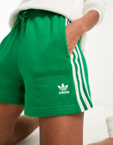 Pantaloncini in jersey verdi con tre strisce - adidas Originals - Modalova