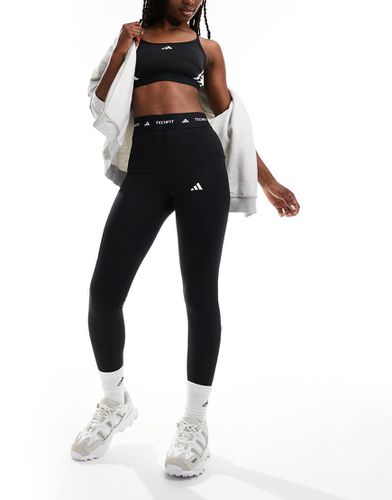 Adidas - Performance Techfit Stash - Leggings neri con tasca - adidas performance - Modalova