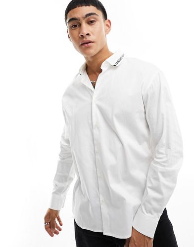 Camicia in maglia in popeline di cotone sporco con colletto con logo a contrasto - Armani Exchange - Modalova