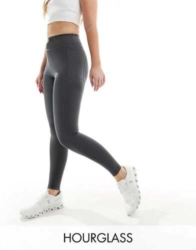 Hourglass - Icon - Leggings da palestra e da corsa allacciati in vita antracite scuro con tasca per il telefono - ASOS - Modalova