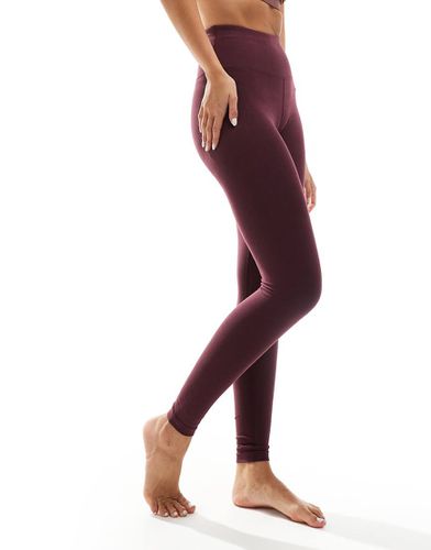 Icon - Leggings da yoga morbidi al tatto color bordeaux - ASOS - Modalova