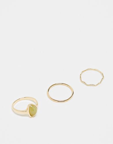 Confezione da 3 anelli ondulati dorati con pietra verde - ASOS DESIGN - Modalova