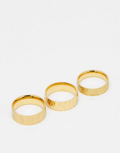 Confezione da tre anelli a fascia in acciaio inossidabile resistente all'acqua con decorazioni in rilievo, colore - ASOS DESIGN - Modalova