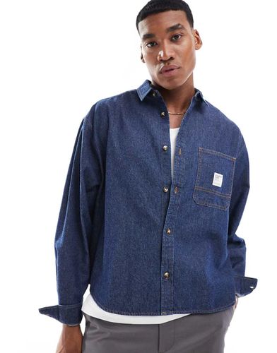 Camicia squadrata oversize in denim con stemma - ASOS DESIGN - Modalova