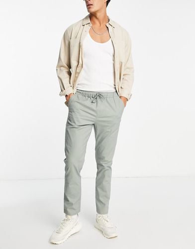 Chino slim chiaro con vita elasticizzata - ASOS DESIGN - Modalova