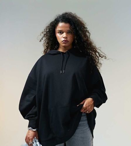 ASOS DESIGN Curve - Felpa oversize nera con cappuccio - ASOS Curve - Modalova