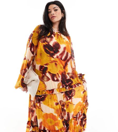 ASOS DESIGN Curve - Vestito grembiule lungo accollato con stampa a fiori sfocata e volant - ASOS Curve - Modalova