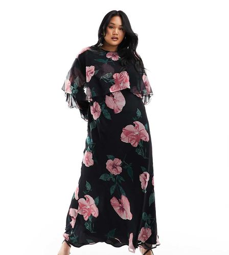 ASOS DESIGN Curve - Vestito lungo a maniche lunghe con volant, taglio sbieco e dettaglio a mantella nero con stampa a fiori - ASOS Curve - Modalova