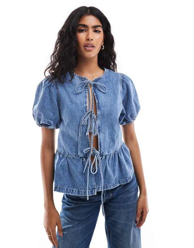 Blusa in denim con maniche a sbuffo e lacci sul davanti - ASOS DESIGN - Modalova