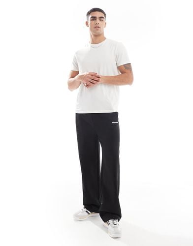 Joggers ampi neri con stampa e zip - ASOS DESIGN - Modalova