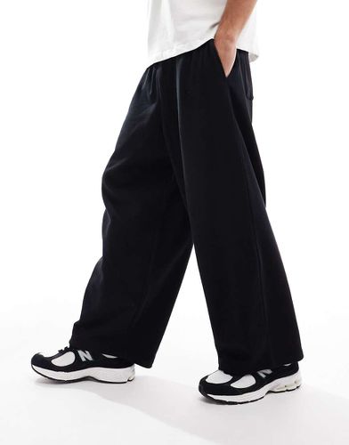 Joggers oversize a palloncino neri - ASOS DESIGN - Modalova