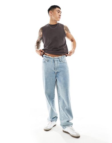 Jeans ampi lavaggio chiaro con fascia in vita grezza - ASOS DESIGN - Modalova