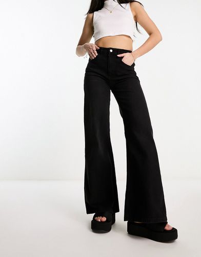 Jeans leggeri con fondo ampio neri - ASOS DESIGN - Modalova