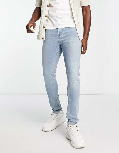 Jeans skinny lavaggio chiaro - ASOS DESIGN - Modalova